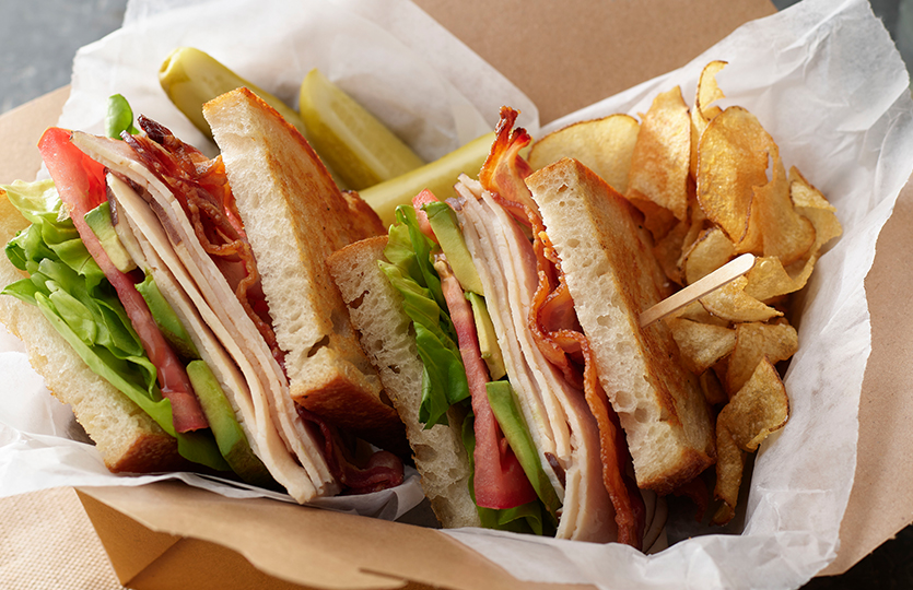 Turkey and cheese sandwiches in basket