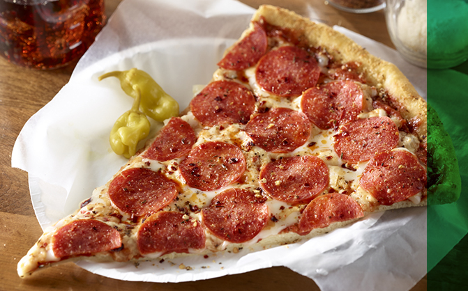 Pepperoni Pizza slice on white paper plate